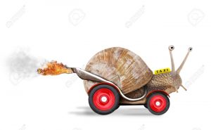 13551897-Speedy-snail-like-car-racer-Concept-of-speed-and-success-Wheels-are-blur-because-of-moving-Isolated--Stock-Photo